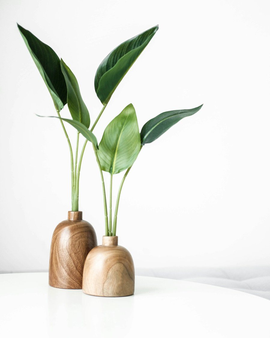 Faux Strelitzia Stems in Wood Vases, Pair